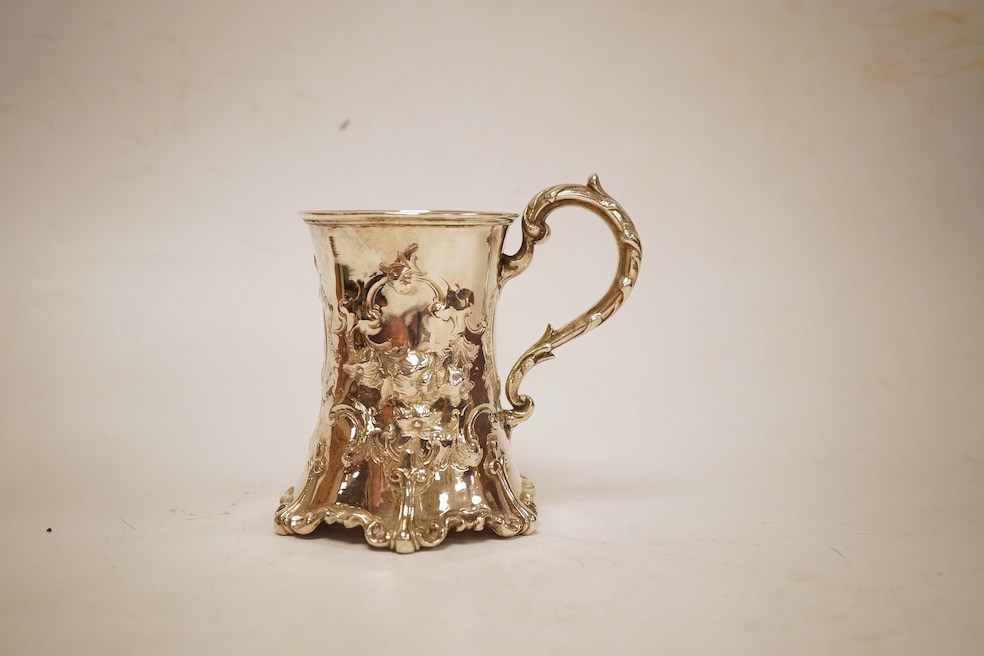 A Victorian embossed silver christening mug, of waisted form, by John Keith, London, 1851, height 10.2cm, 5.8oz.